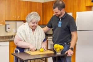 occupational therapist with a resident at Patewood Post Acute