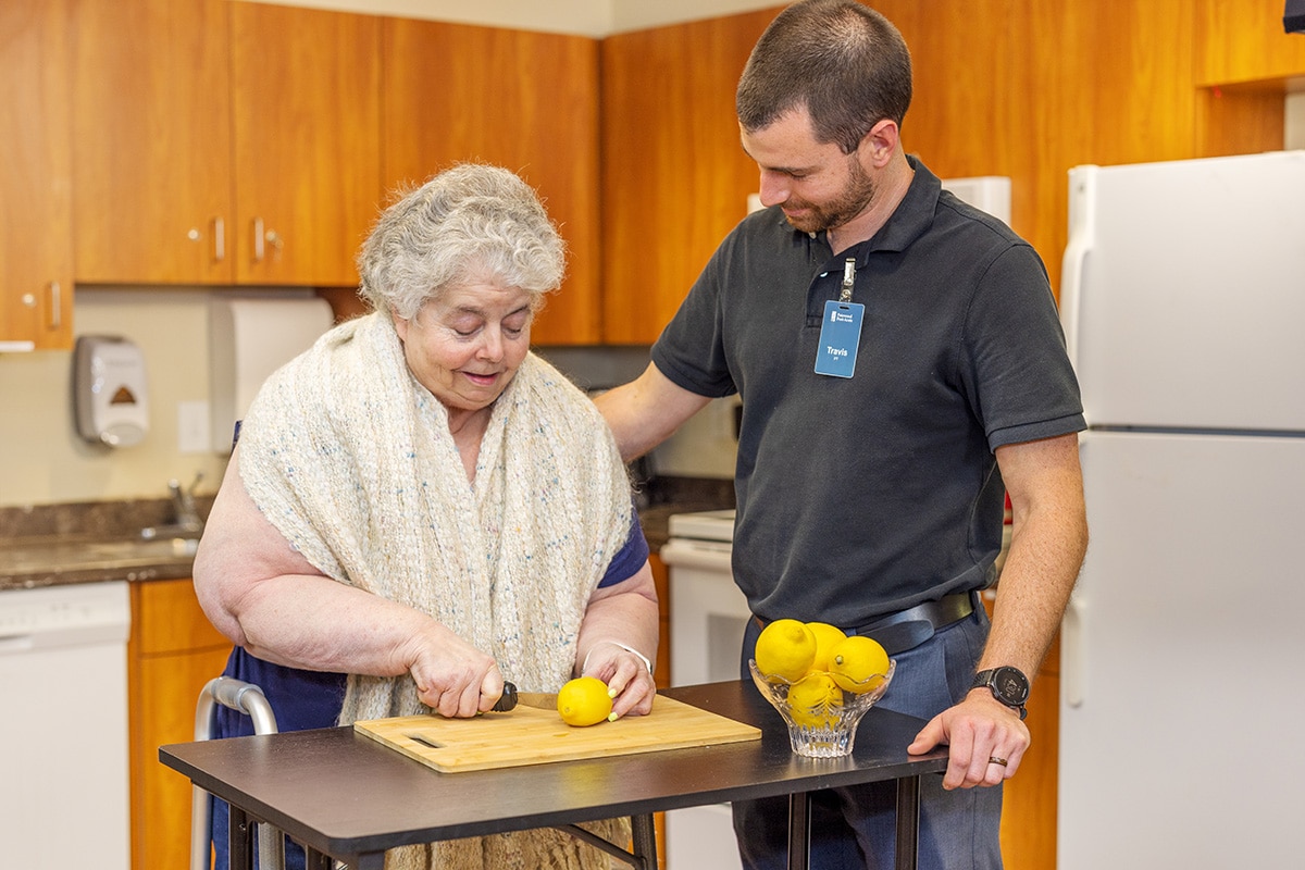 occupational therapist with a resident at Patewood Post Acute